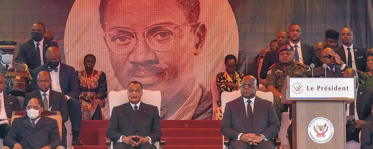 President Felix Tshisekedi of the Democratic Republic of Congo (right) and his counterpart from neighbouring Congo Denis Sassou Nguesso (left) attend the funeral ceremony in Kinshasa on 30 June. Patrice Lumumba's coffin lies in a concrete and glass mausoleum, which is due to open to the public at the end of August. © Arsène Mpiana / AFP